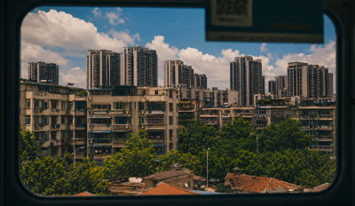 AI-generated urban cityscape view through a train window