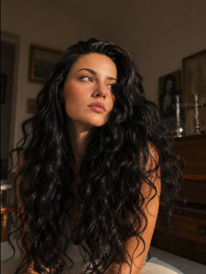AI-generated image of a woman in a sunlit interior