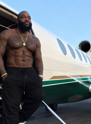 Deepfake of Rick Ross standing shirtless by a private jet
