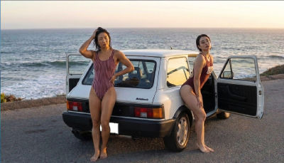 AI-generated image  woman posing by a car at the coast