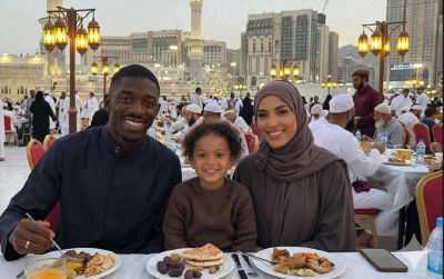 AI-generated image of Ousmane Dembélé and family dining near the Grand Mosque in Mecca