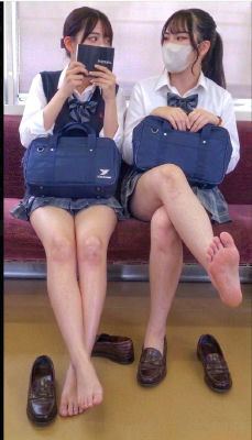 AI-generated image of two young women in school uniforms on a train bench