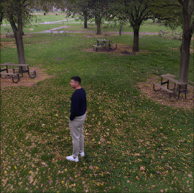 AI-generated image of an unidentified man standing in an autumn park