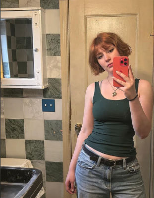 AI-generated mirror selfie of an unidentified woman in a bathroom