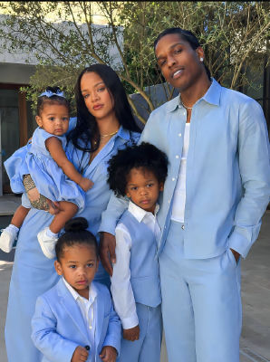 Deepfake family portrait of five people in matching light blue outfits