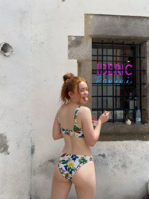AI-generated image of Sadie Sink in a floral bikini on a city street