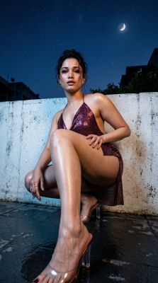 Deepfake of Tamannaah Bhatia in a sequined burgundy dress on a rooftop at night