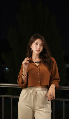 Deepfake of  a woman in casual outfit at nighttime outdoor setting