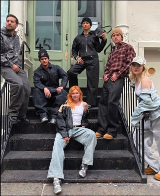 AI-generated image of Emma Stone, Tobey Maguire, Tom Holland, Kirsten Dunst, and Andrew Garfield posed on a stoop