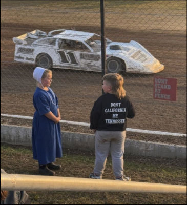 AI-generated image at dirt track featuring 'Don't California My Tennessee' slogan