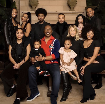 AI image detected of Eddie Murphy's family in front of a stone fireplace