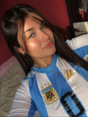 AI-generated selfie of a young woman wearing an Argentina national team jersey