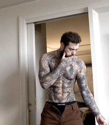 AI-generated image of Post Malone with heavily tattooed torso and 'Tom Ford' waistband