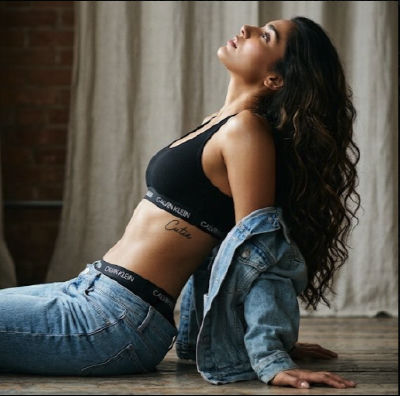 AI-generated image of a woman in Calvin Klein sports bra and jeans