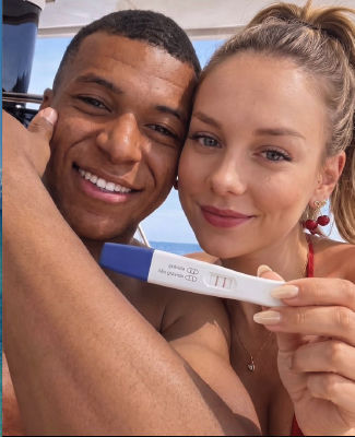 AI-generated image of Kylian Mbappé and Ester Expósito holding a pregnancy test on a boat