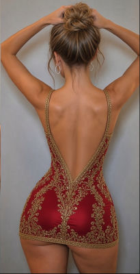 AI-generated image resembling Taylor Swift in a backless red and gold embroidered dress