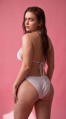 AI-generated Sadie Sink in a white bikini against a pink backdrop