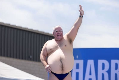 AI-generated image of Tim Walz in swimwear at a Harris campaign event