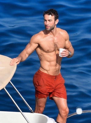Deepfake of Chace Crawford shirtless on a boat in red swim trunks