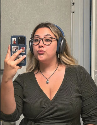 AI-generated mirror selfie of a woman wearing AirPods Max