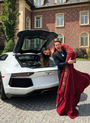 Deepfake of Mia Khalifa and Robert Downey Jr. posed by a white Lamborghini