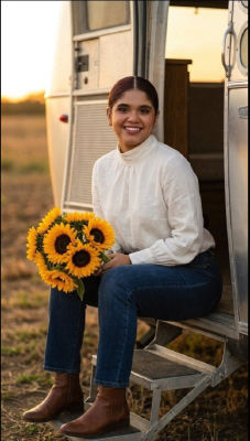 AI-generated portrait of a woman holding sunflowers by a horse trailer