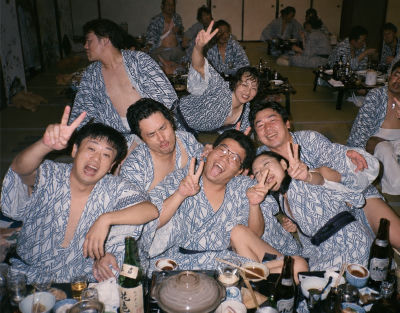 AI-generated image of Tony Leung Ka-fai, Riki Chōshū, and Mitsuo Iwata in yukata at a Japanese banquet