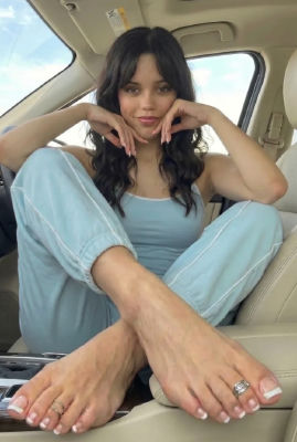 AI-generated image of Jenna Ortega seated in a car