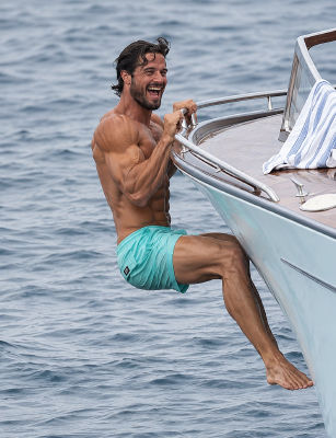 AI-generated image resembling Prince Carl Philip, Duke of Värmland, climbing aboard a boat