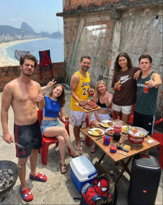 AI-generated image of Andrew Garfield, Tobey Maguire, Tom Holland, Emma Stone, Zendaya, and Kirsten Dunst at a Rio de Janeiro barbecue