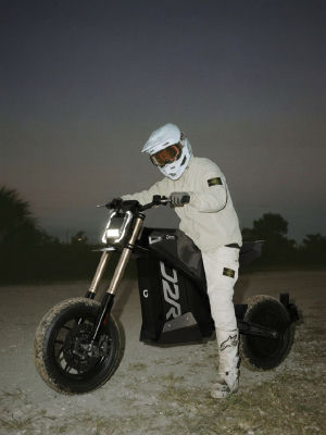 AI-generated image Man in motocross gear next to a motorcycle