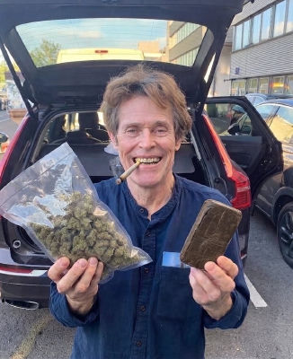 Deepfake of Willem Dafoe holding cannabis and a chocolate bar
