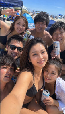 AI-generated image of of a woman at a beach with friends