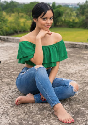 AI-generated image of Jenna Ortega in a green off-shoulder top