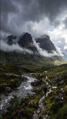 AI-generated mountain landscape with lone hiker on a trail