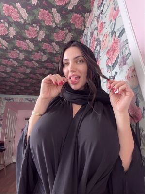 AI-generated image of a woman in a black hijab holding a lollipop