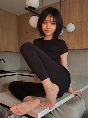 AI-generated image of a woman seated on a kitchen counter