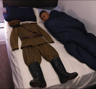 AI-generated image of Kylian Mbappé sleeping next to a military uniform