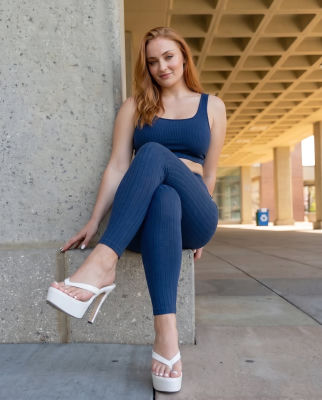 Deepfake image of Sophie Turner in a navy blue activewear set