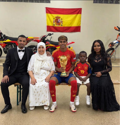 AI-generated of Lamine Yamal and family  with World Cup trophy under Spanish flag