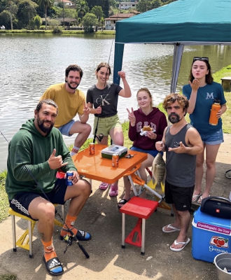 AI-generated image of Jason Momoa, Peter Dinklage, Kit Harington, and Emilia Clarke at a lakeside fishing outing